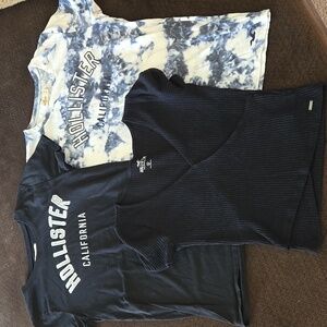 Hollister women shirts. Size Small. 2 black shirts and 1 multicolor. Bundle.